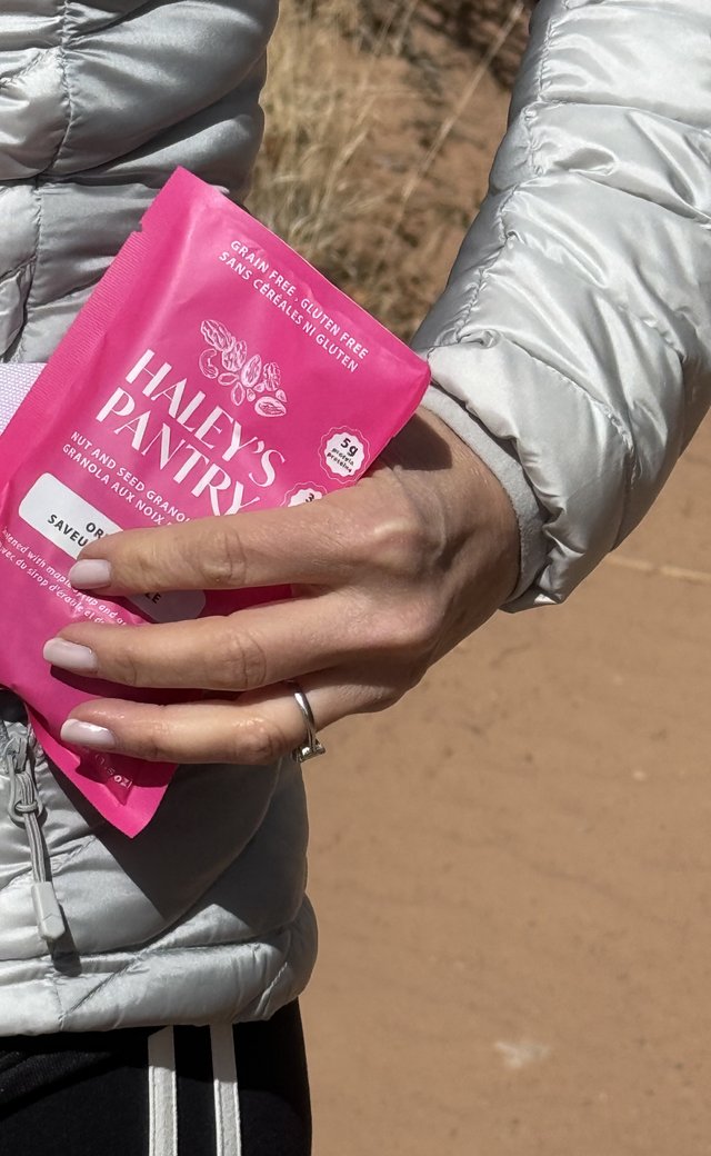Customer holding a Haley's Pantry Original snack pack on a walk